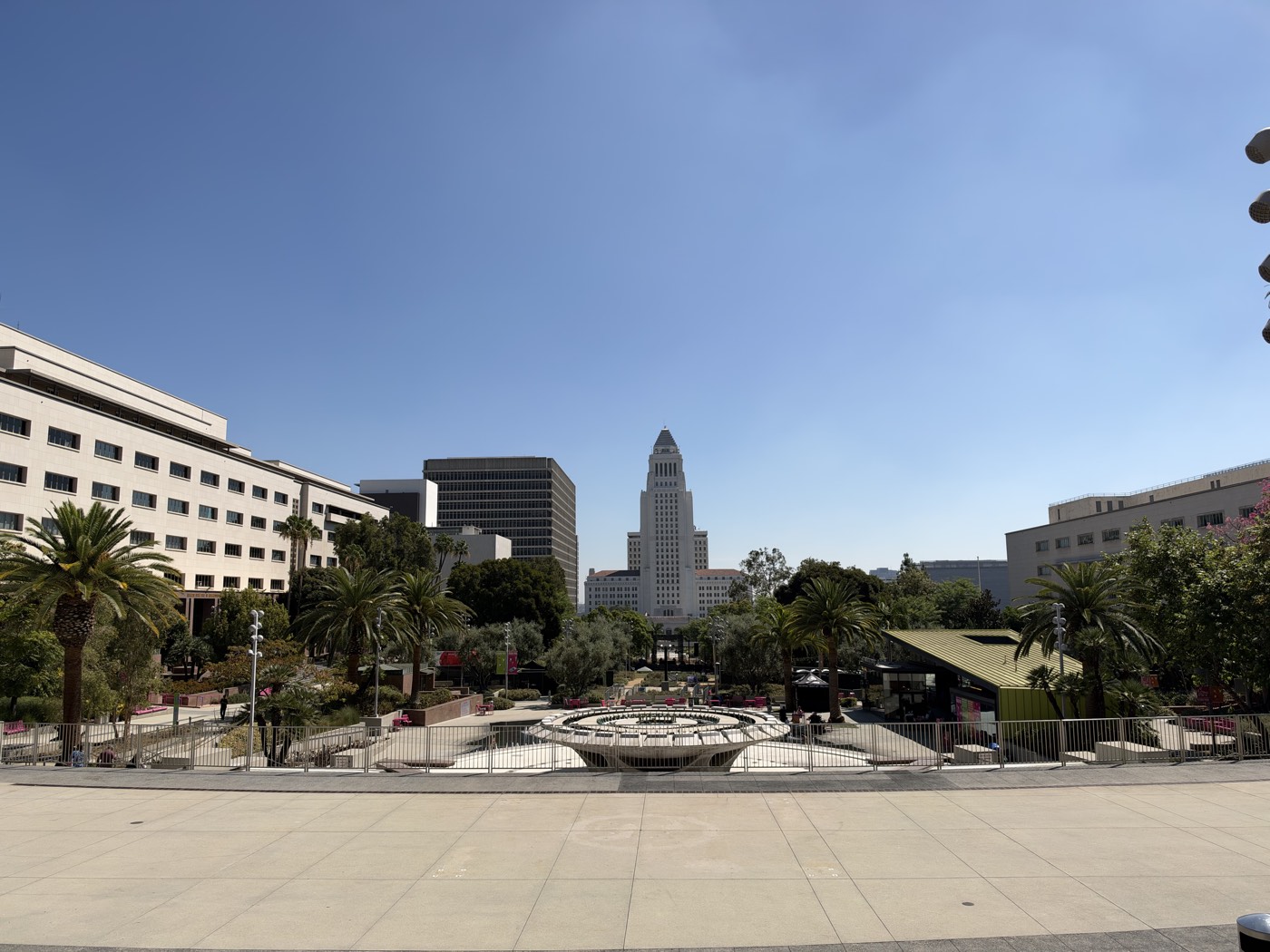 Grand Park in the Los Angeles civic center, looking east past palm trees and county buildings to Los Angeles City Hall
